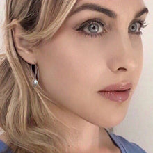 Load image into Gallery viewer, sleek twist pearl earrings
